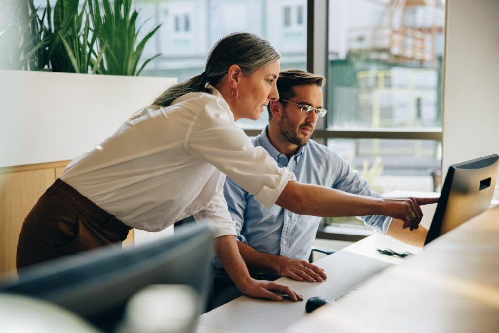 Man and woman working together on a computer